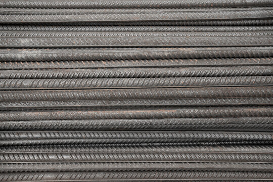 Reinforcing Steel Bar closeup. Reinforcement steel rod and deformed bar with rebar at construction site. Steel rods bars can used for reinforce concrete. Reinforced iron for concrete construction.