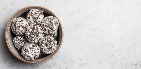 Coconut chocolate balls. Candy. Dessert. Vegetarian food.