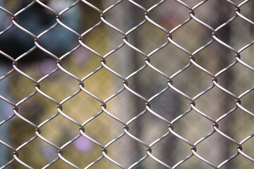 Metal mesh on the fence as a background.