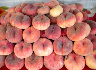 Peaches on the counter in the market.