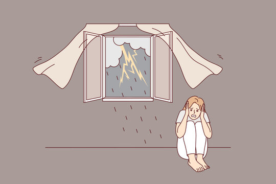 Scared girl sitting on floor afraid of storm outdoors. Terrified young woman feel stressed and frightened of lightning and thunderstorm. Vector illustration. 