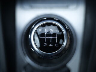 close up of a six speed shift gear stick knob