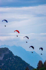 Paramotors in the sky over the mountains