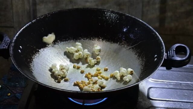 popcorn explodes in the pan. HD videos.