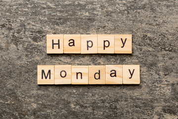 Happy monday word written on wood block. Happy monday text on cement table for your desing, concept