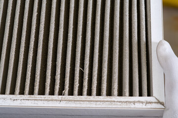 HVAC filter needs to be replaced, Dirty old filter with dust. Dirty Air filter for home central air...