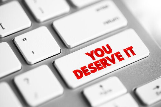 You Deserve It text button on keyboard, concept background