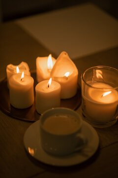 Coffee and candles on the table, background photography