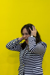 Girl screaming and clutching her head isolated, Excited girl screaming and clutching her head on isolated background. Portrait of girl clutching her head screaming on isolated background