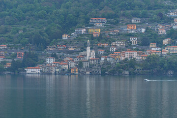 Fototapeta na wymiar the towns and the shores of Lake Como, during a fantastic day in late spring - May 2022