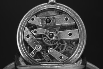 Vintage clock mechanism. Gears and springs. Nice clean condition. Black background. Close up. Black...