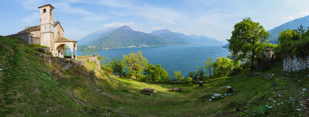 The landscape of Lake Como during spring, near the town of Musso, Italy - May 2022.