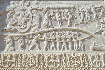 graceful beautiful historical bas-reliefs on the facade of the building