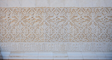 graceful beautiful historical bas-reliefs on the facade of the building