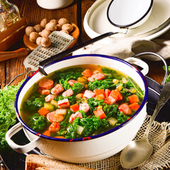 autumnal kale soup with sausage and bacon cubes