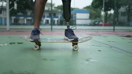 Disabled person riding skateboard with prosthetic leg. Athletic skateboarder amputee