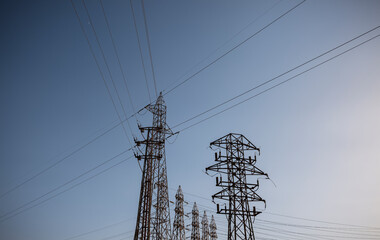 Transmissions towers against blue sky