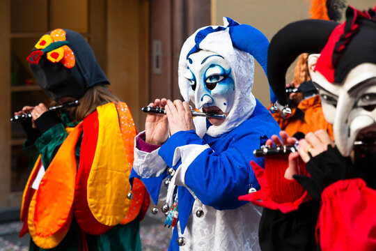 Switzerland, Basel, 8 March 2022. Close-up of a disguised group of piccolo flute players