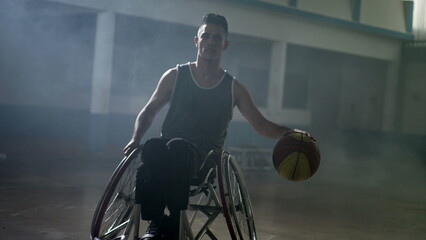 A hispanic disabled basketball player in a wheelchair portrait with serious expression. Determination and motivation concept