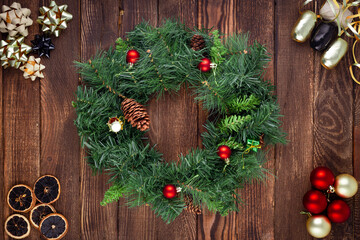 Christmas wreath on wooden background. Mock up. Greeting card.