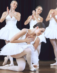 Ballet, dance and art with a woman ballerina or dancer dancing on a theater stage during a...