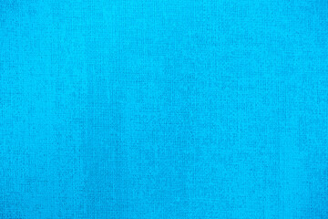 Blue background of decorative plaster with abstract spots. Unusual texture of this wall with beautiful patterns, creative surface background. Finishing coating for building cladding.