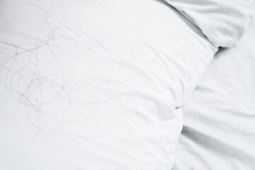 close up hair loss fallen on pillow ,health care and medical concept