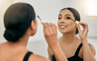Woman, makeup and mascara in a mirror for beauty on her eye with a smile in a room. Young beautiful latino female with cosmetics and skincare daily routine on her face with a brush for fashion