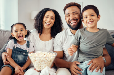 Love, laugh and watching tv or a movie with a happy family eating popcorn, having fun and smile...