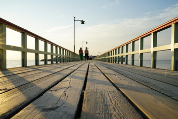 Wooden pier connecting Malmo's Ribersborg Beach with the Ribersborgs Kallbadhus public bath - obrazy, fototapety, plakaty
