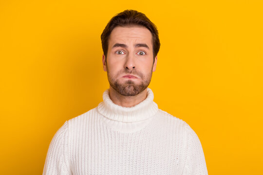 Photo Of Funny Childish Guy Inflate Cheeks Hold Breath Underwater Wear White Sweater Isolated Yellow Color Background