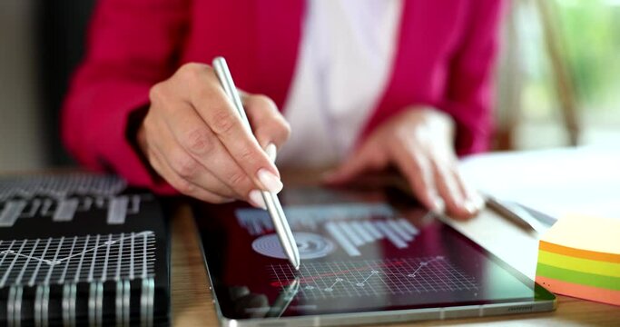 Female manager drawing upward arrow on chart closeup 4k movie slow motion 