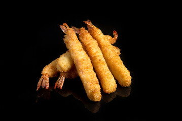fried shrimp in batter on a black background for the menu