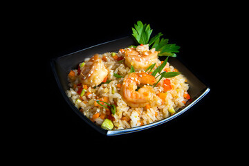 wok with vegetables and shrimp on a black background