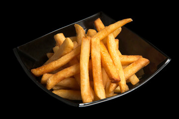 fried french fries on a black background