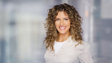 Young business woman with a friendly expression