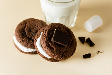 Smores Dessert with Cookie Marshmallow and Chocolate with Glass of Milk Yellow Background