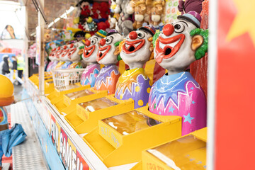 Laughing clowns game attraction at a fair carnival