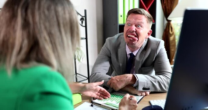 Businessman fooling around and making faces while talking to colleague 4k movie slow motion 