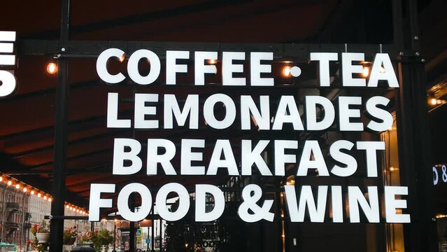 sign first coffee food tea lemonades and wine restaurant window marketing. High quality 4k footage. city business food drinks