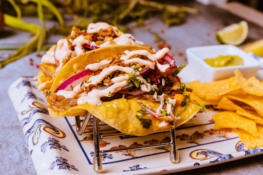 baos of bull meat and nachos
