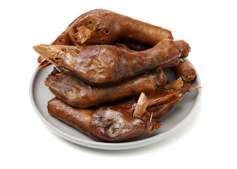 Duck head with marinated sauce on white background