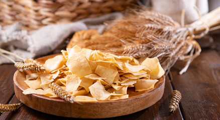 Bread chips, a typical appetizer for aperitivo, dinner in southern Italy and Sardinia. Thin baked...