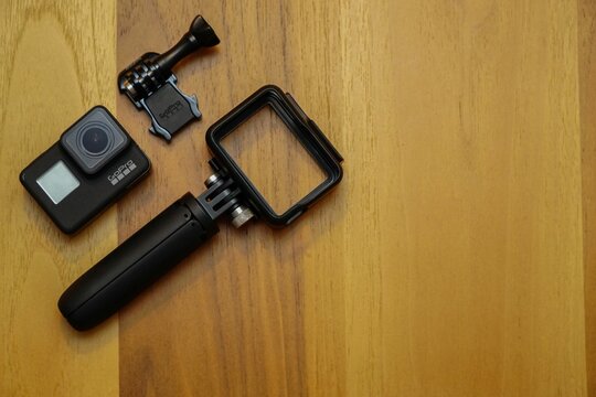 Closeup Of Gopro 7 Black Assorted Accessories On Wooden Background With Copyspace