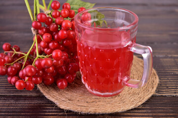 A glass of vitamin tea from viburnum berries. Close-up.
