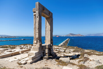 Naxos island, Temple of Apollo on islet of Palatia, Cyclades Greece. Sea, harbor, sky background.