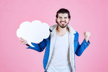 Man holding a cloud shape blank thinkboard and feeling like a winner