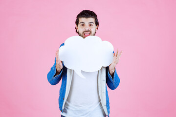 Man holding a cloud shape blank thinkboard and having fun