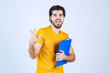 Man with blue folder feeling cool