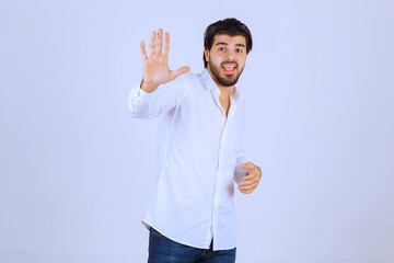 Man trying to prevent or reject something